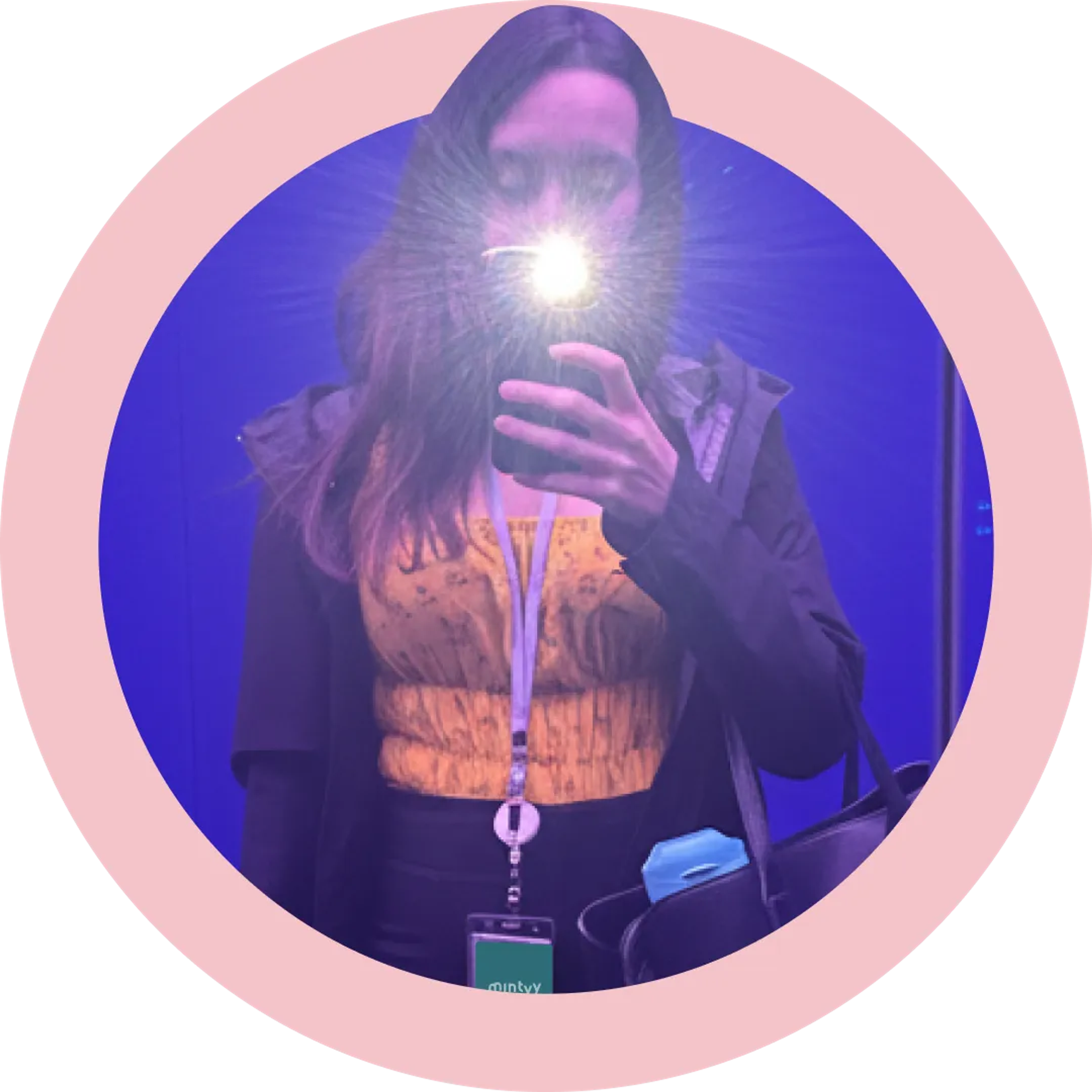 A headshot of Ren holding a phone, flashing.