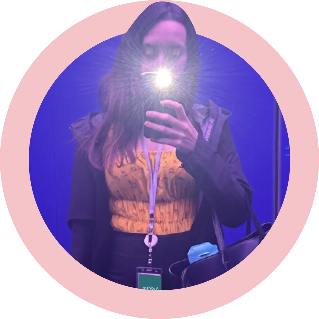 A headshot of Ren holding a phone, flashing.