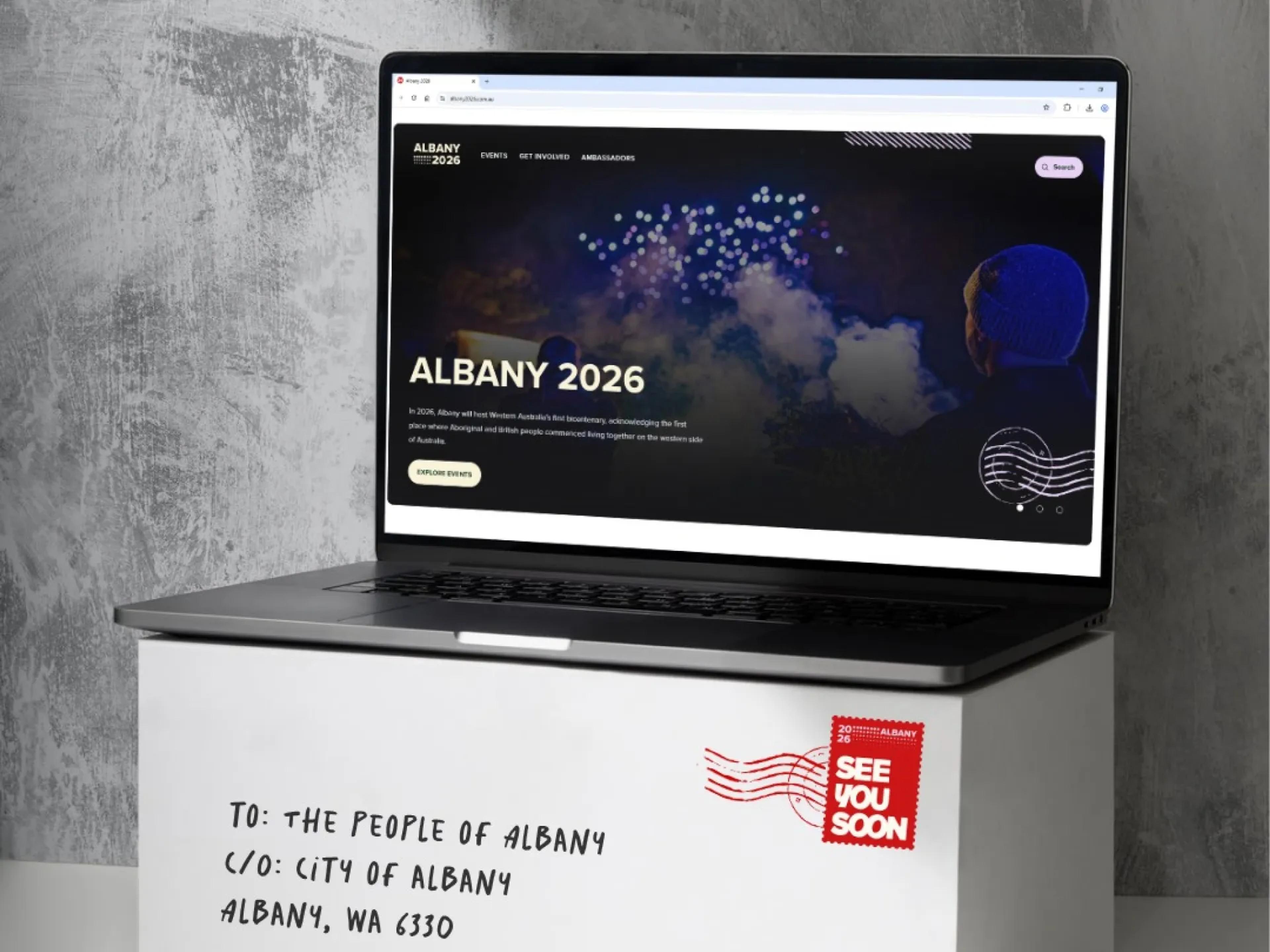 A mockup of the Albany 2026 website on a laptop.