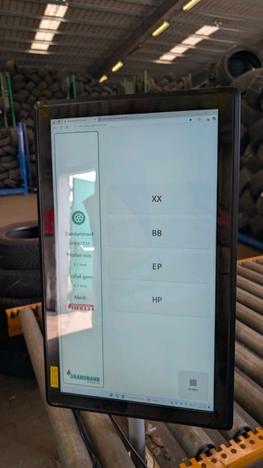 Tire classification screen next to machine