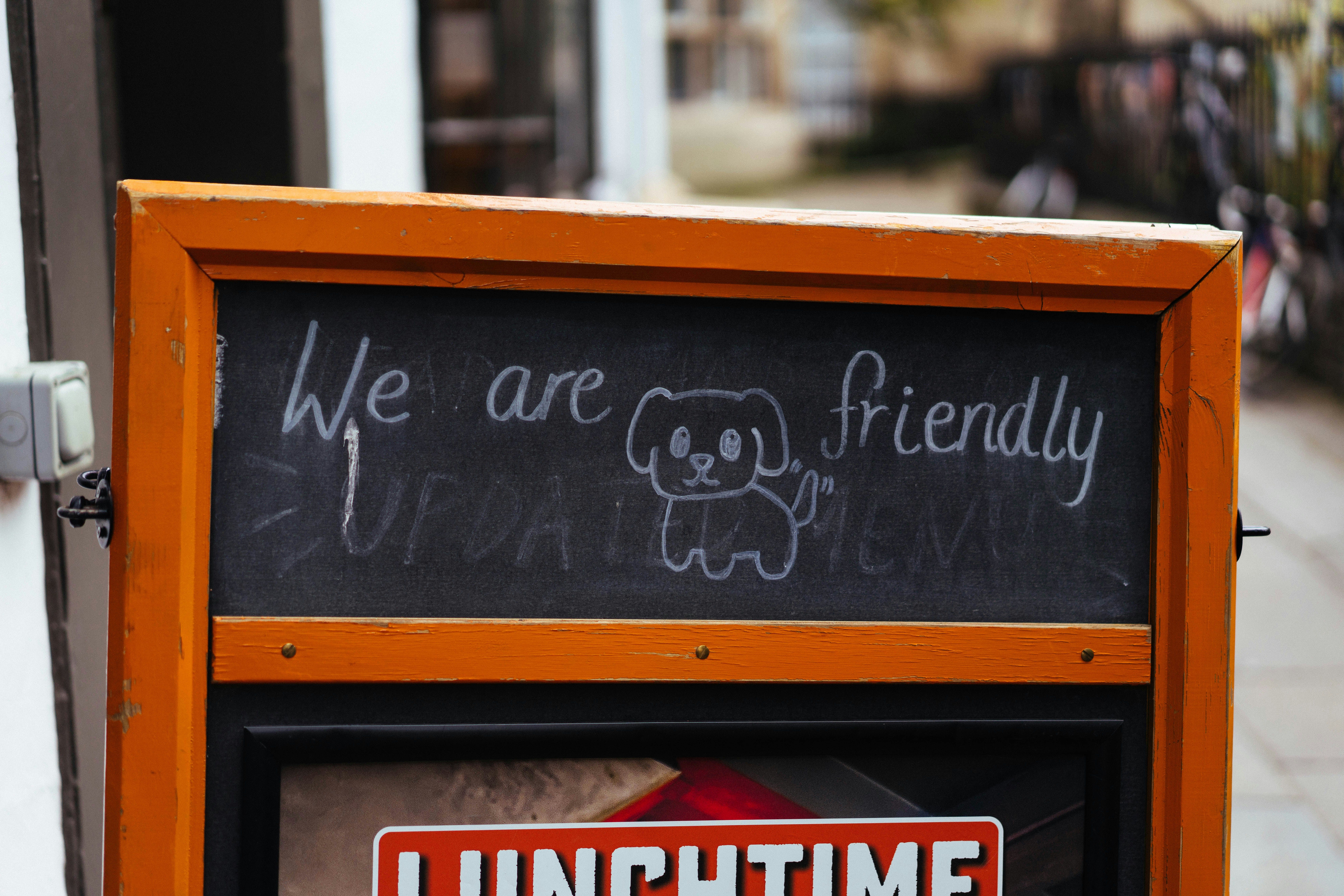 Dog-friendly café sign with a hand-drawn dog