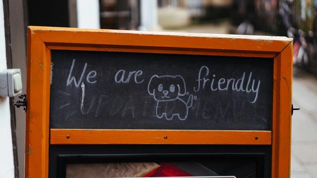 Dog-friendly café sign with a hand-drawn dog