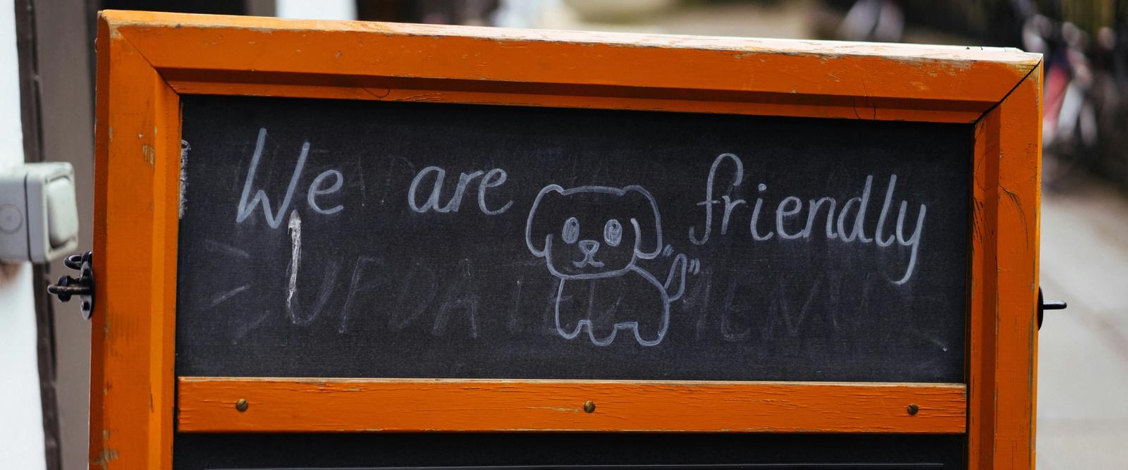 Dog-friendly café sign with a hand-drawn dog