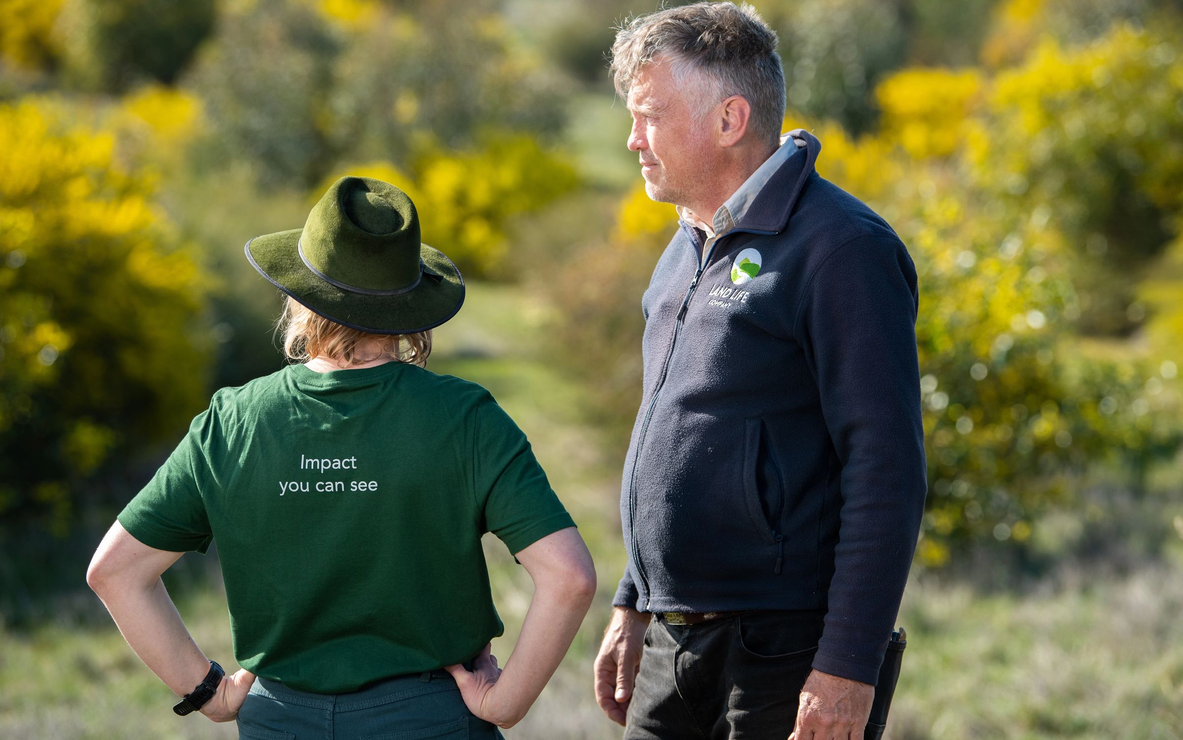 Two people on reforestation site