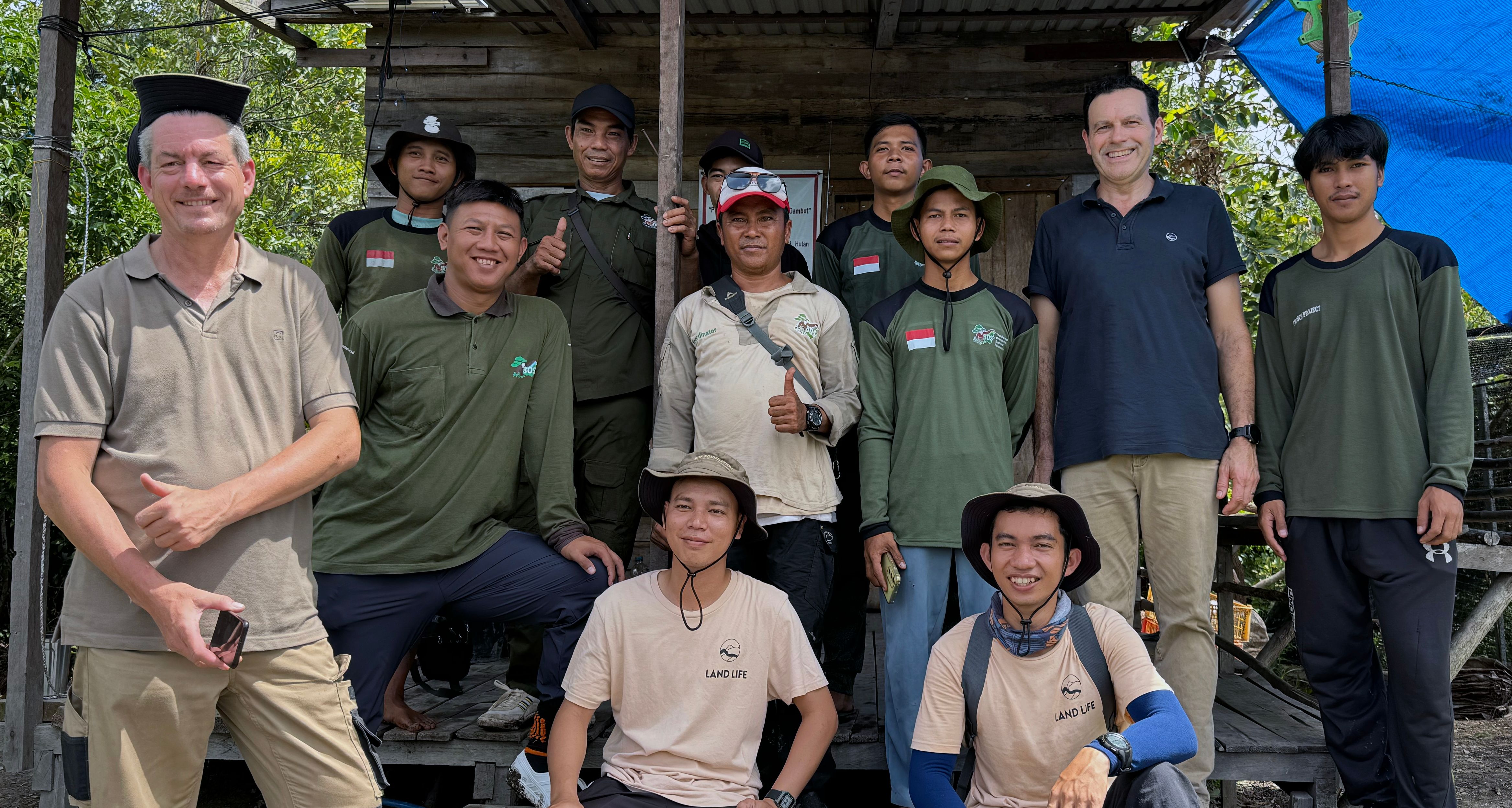 Group shot of restoration team in Borneo