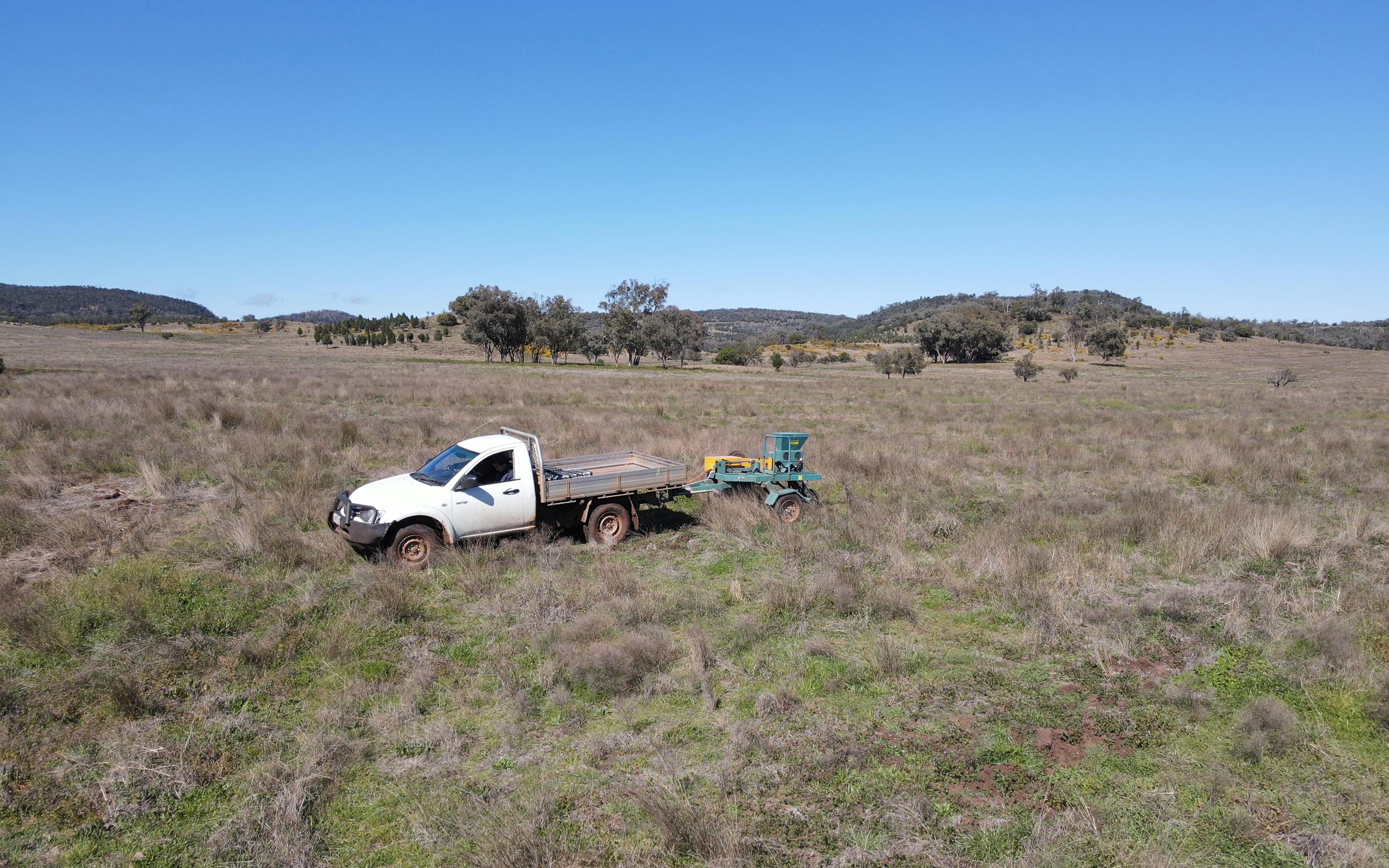Ute driving on degraded farmland