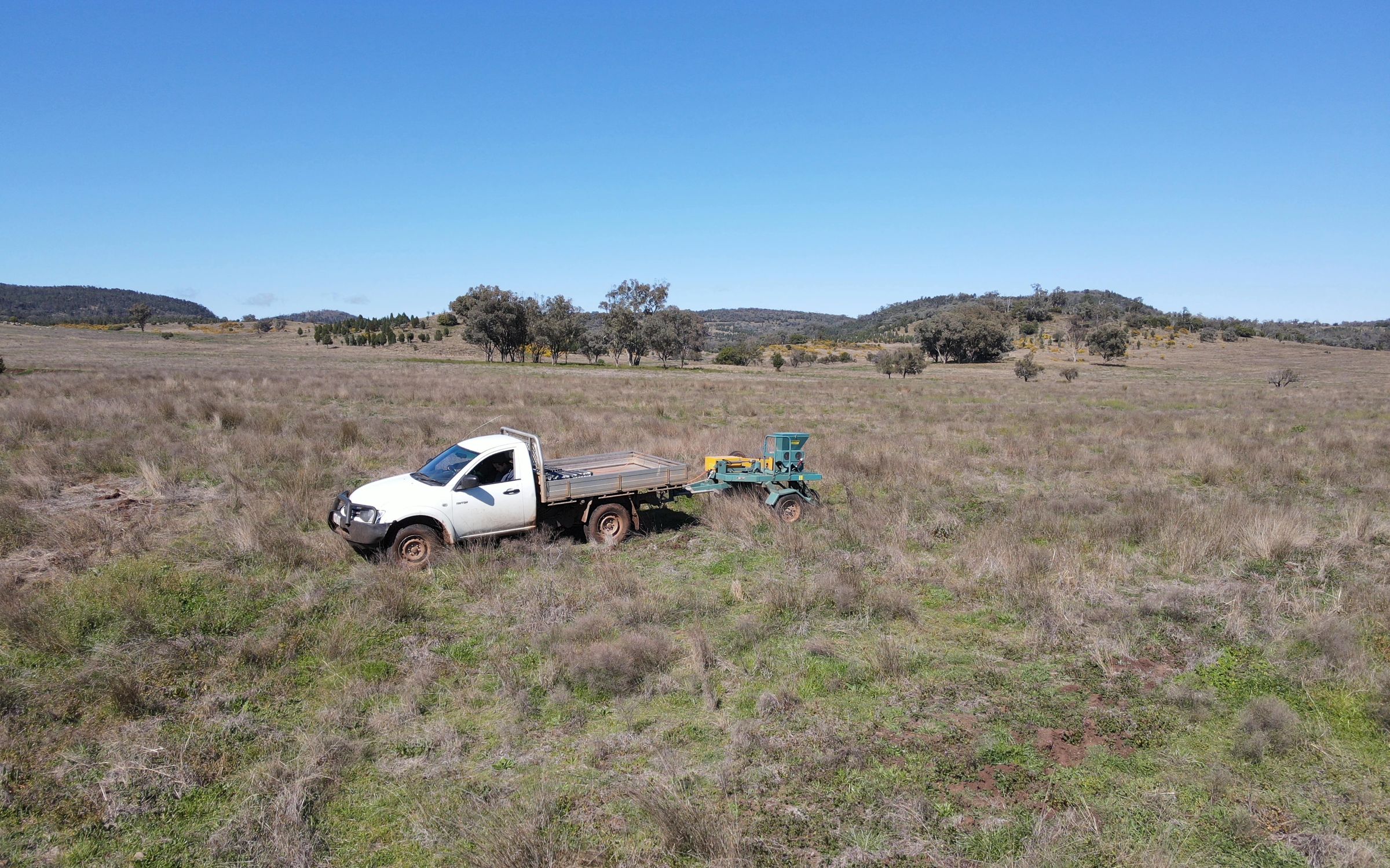 Ute driving on degraded farmland