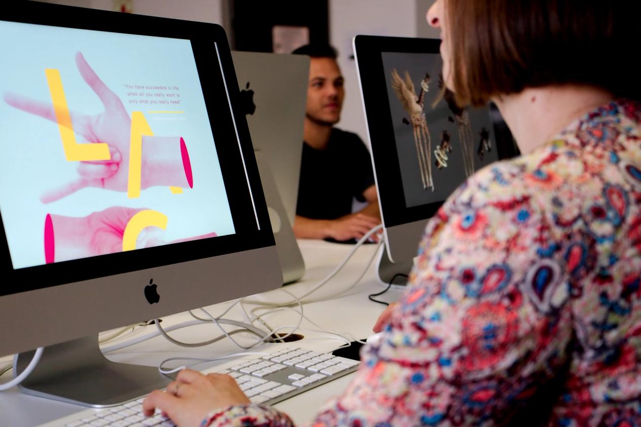 Over-the-shoulder shot for UX/UI student work. Academy of Digital Arts. 