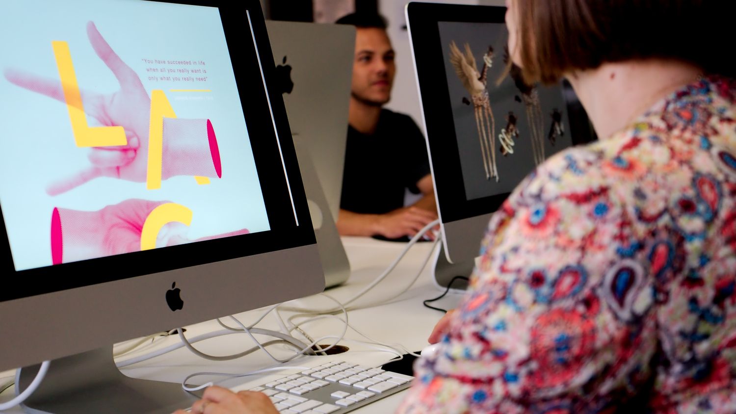 Over-the-shoulder shot for UX/UI student work. Academy of Digital Arts.