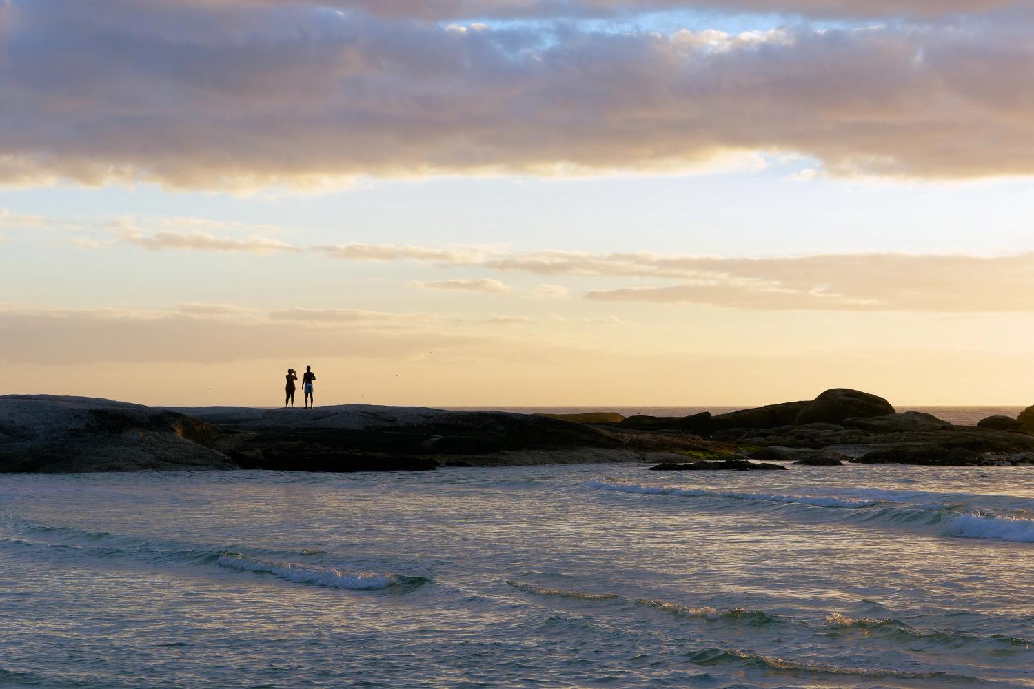 A couple enjoying an evening on one of the beatiful beaches around Cape Town, South Africa