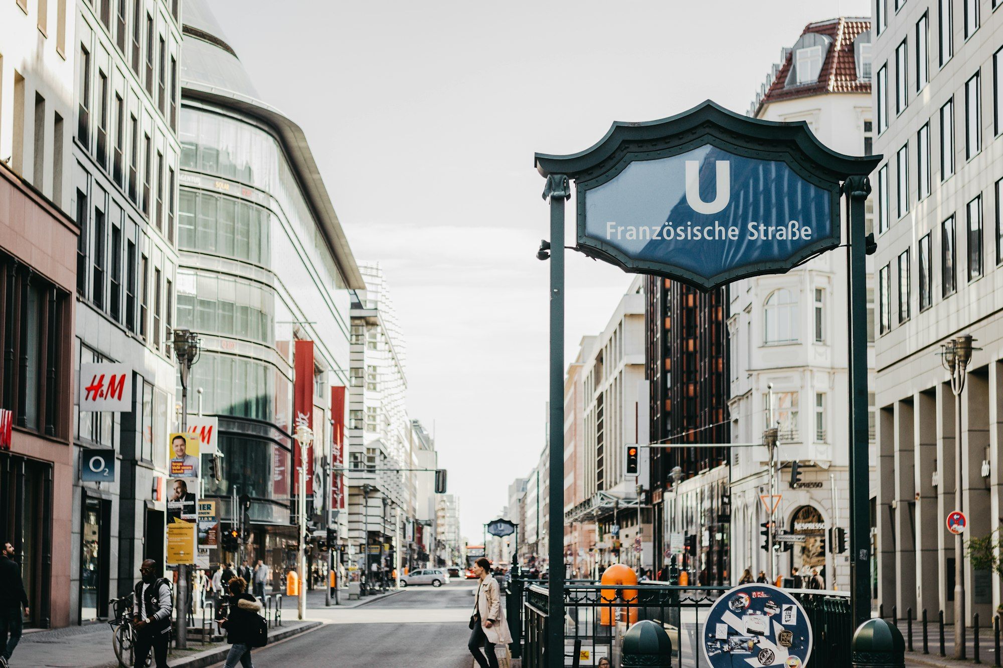 A city street with people walking on the sidewalk in Berlin