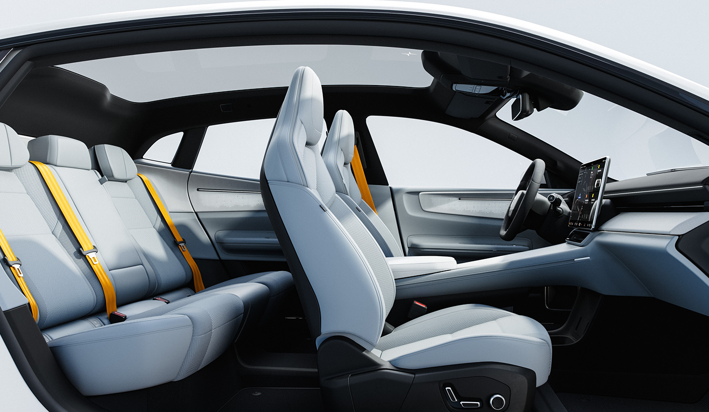 An interior shot of the Polestar 4 displaying the interior from the dashboard to the rear passenger seats