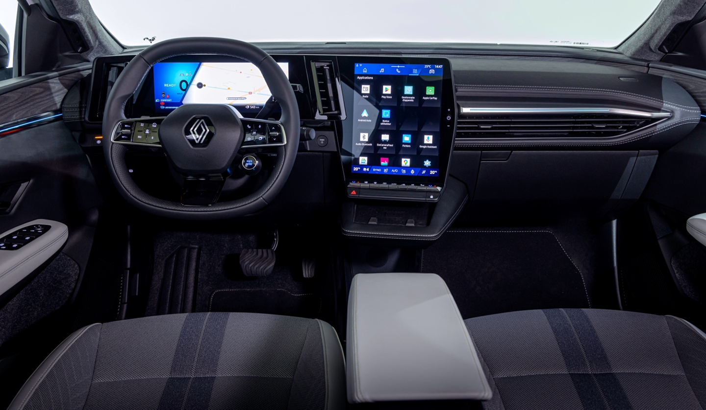 An interior shot of the Renault Scenic E-tech displaying the steering wheel and dashboard