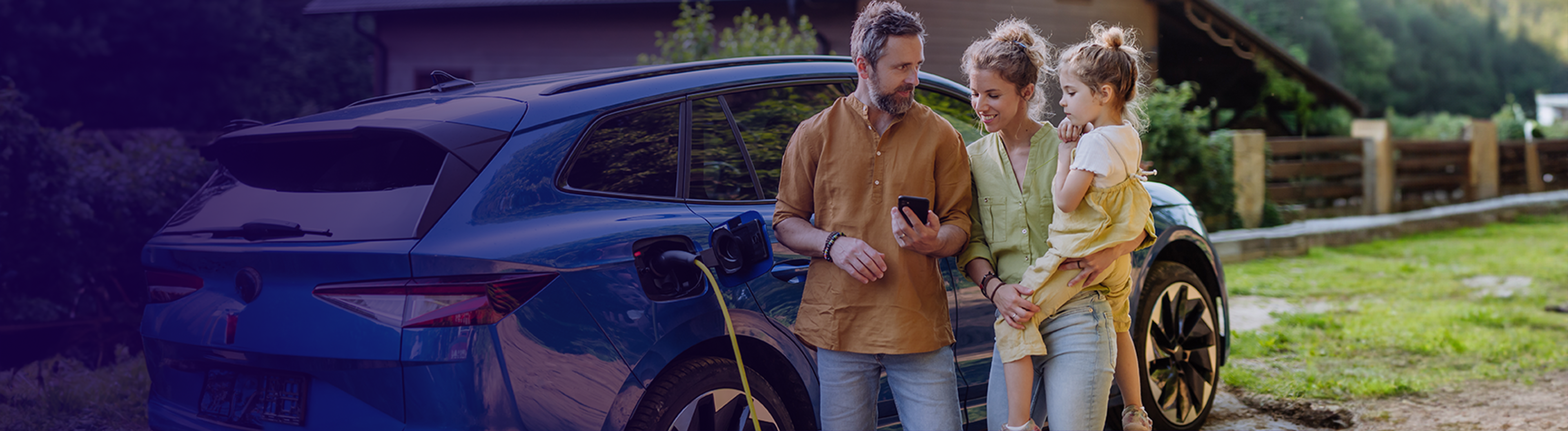 Family huddled around charging vehicle