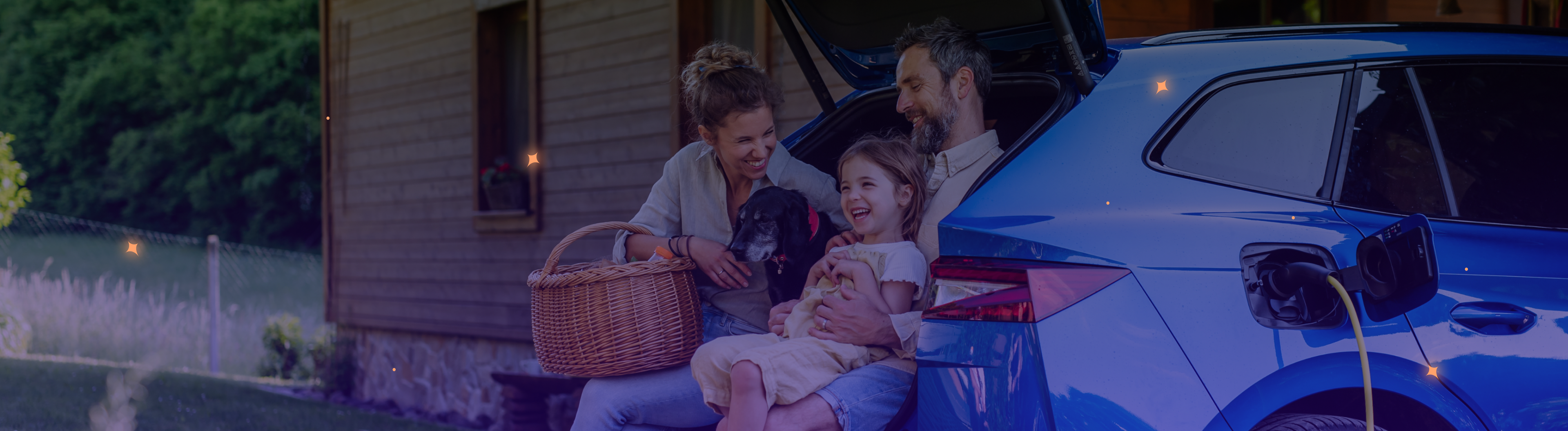 Happy family sat with their EV