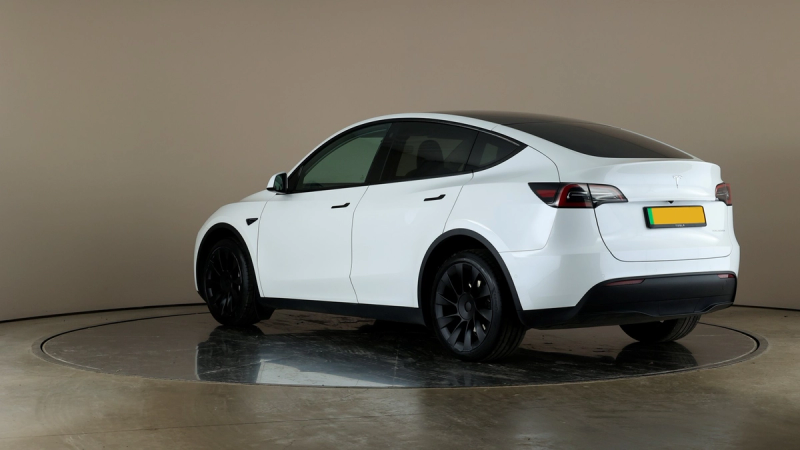 Tesla model y white rear left