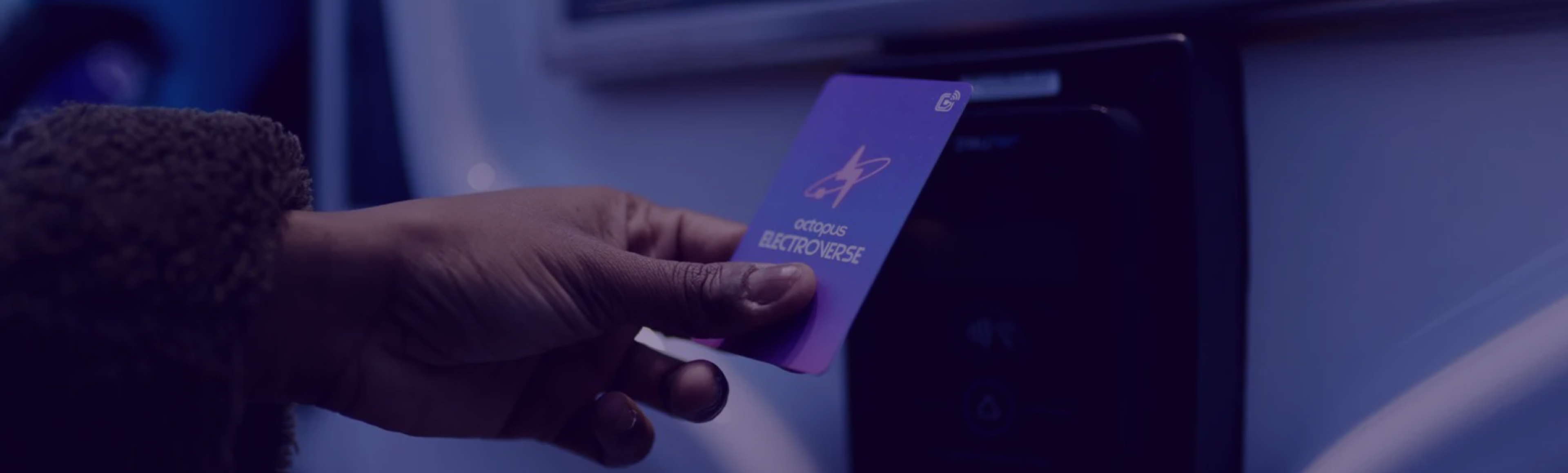 Image of someone tapping an Electroverse card