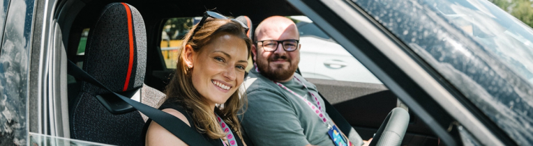 Man in EV peering out through the window