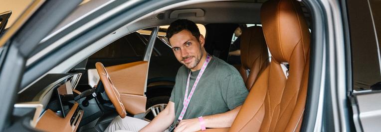 Man in EV peering out through the window