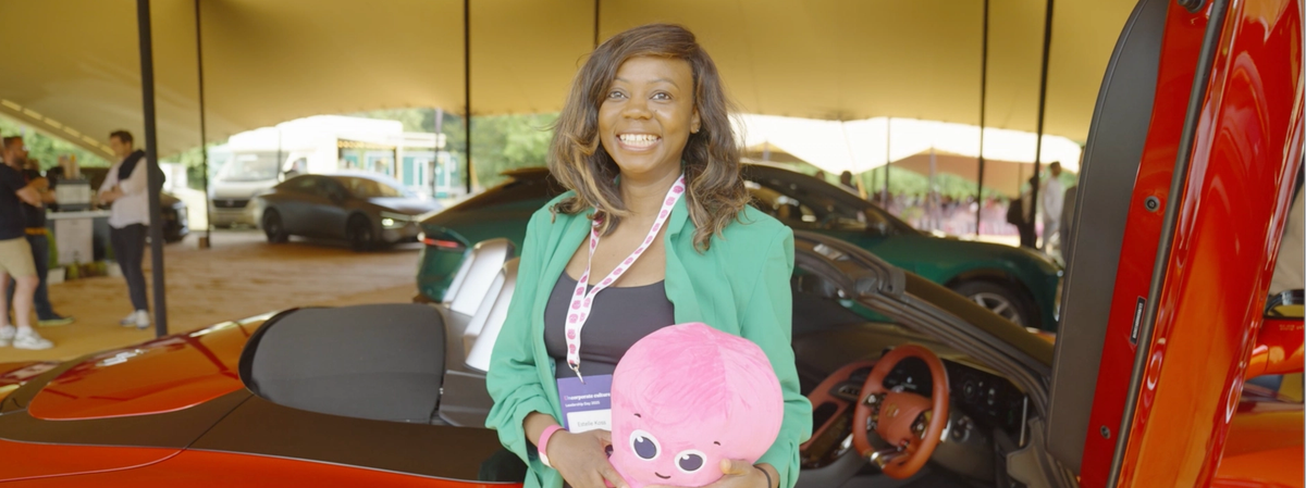 Estelle, Head of People at Whisper TV - holding a plushie Octopus