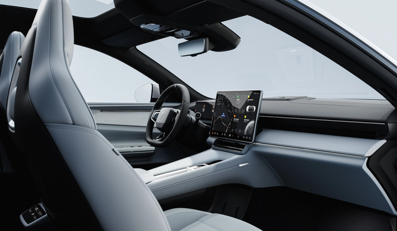 An interior shot of the Polestar 4 displaying the front two seats and the dash