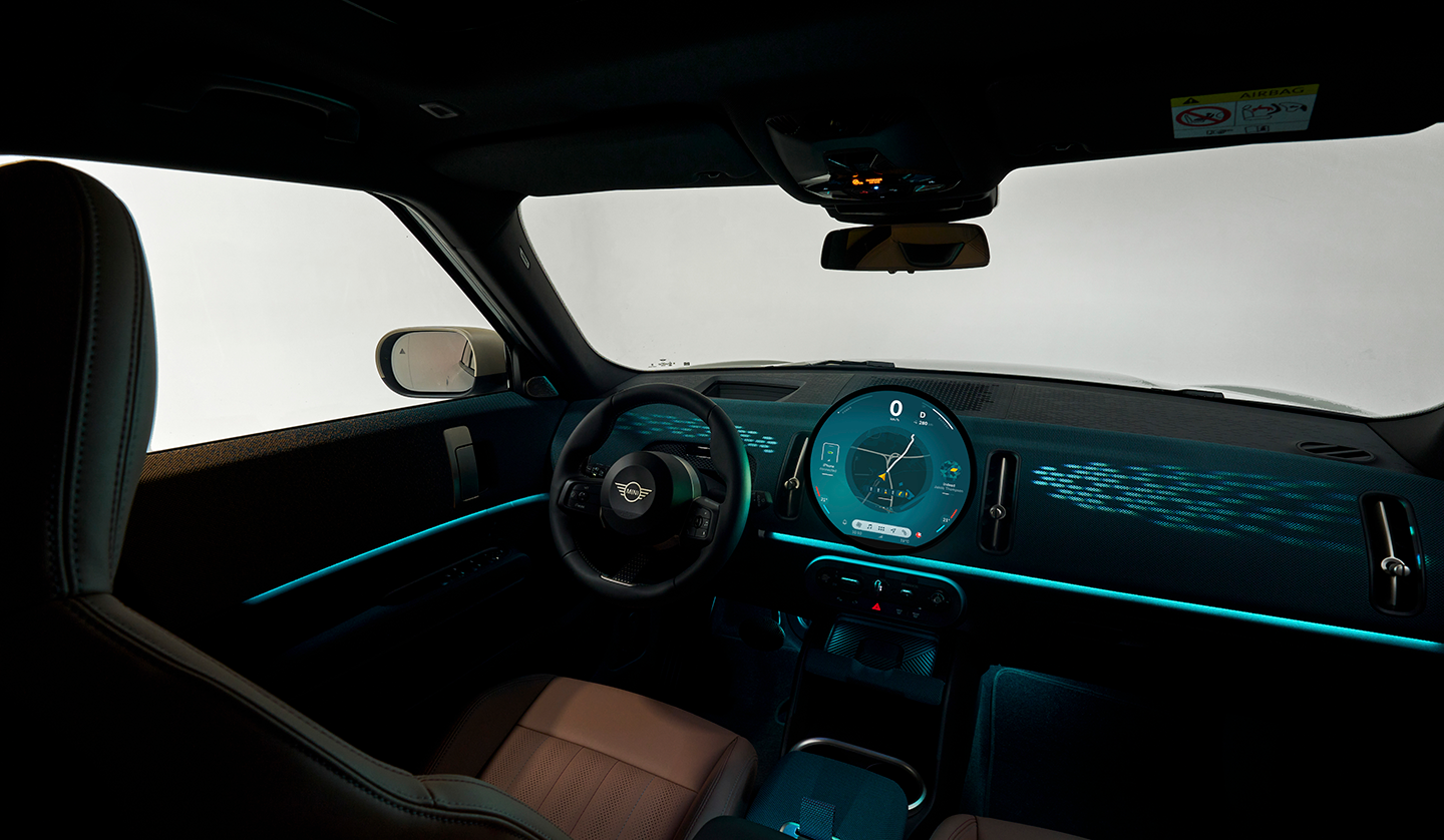 An interior short of the Mini Countryman displaying the dash and steering wheel