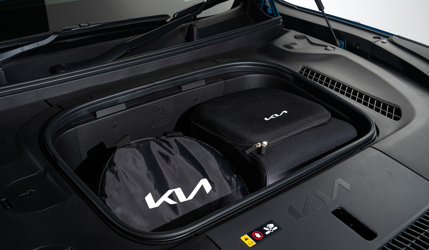 An interior shot of the KIA EV9 displaying storage space