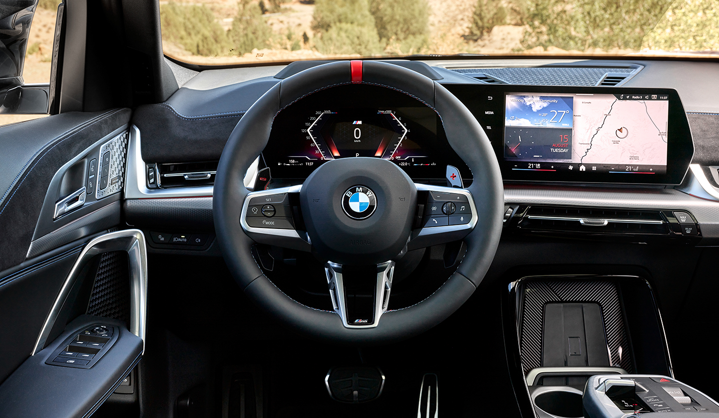 An interior shot from the driver seat showing the steering wheel & dash