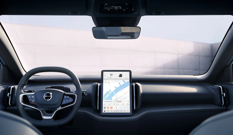 An interior shot of the Volvo EX30, showing the steering wheel and dashboard