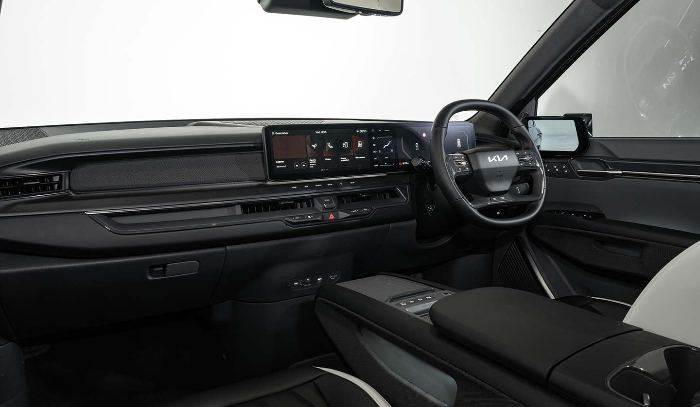 An interior shot displaying the KIA EV9 Steering wheel and Dash