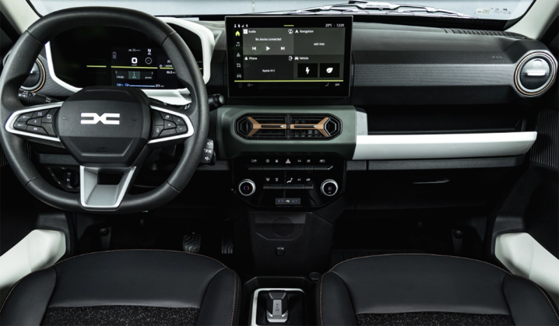 An interior shot of the Dacia Spring, showcasing the steering wheel and dashboard