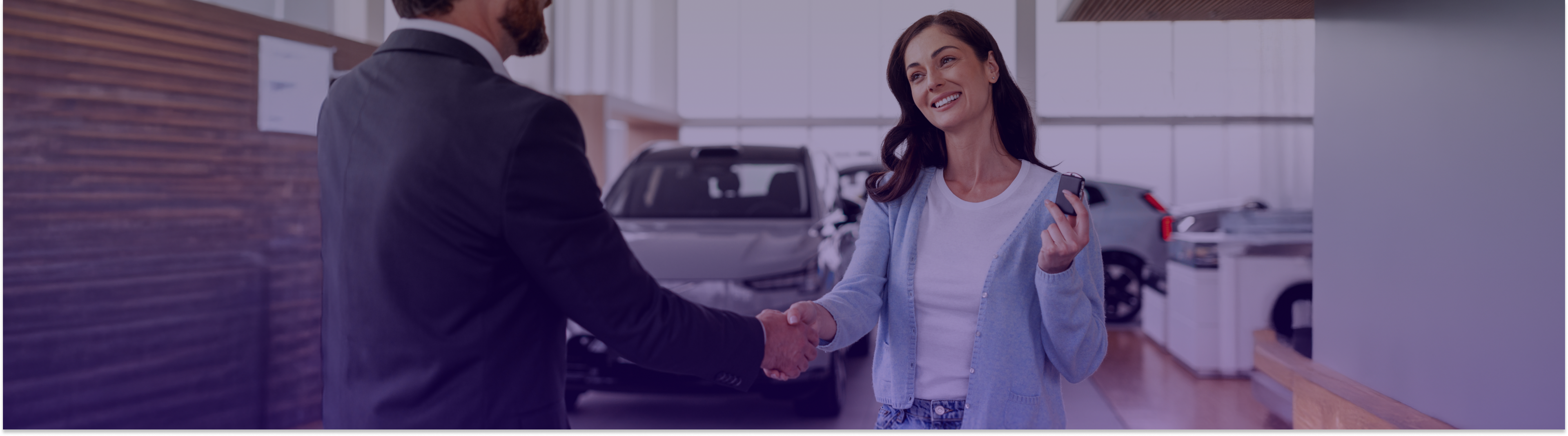 Happy customer in a car dealership 