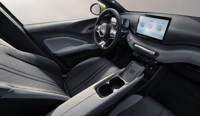 Interior shot of the BYD Dolphin Surf displaying the steering wheel and infotainment