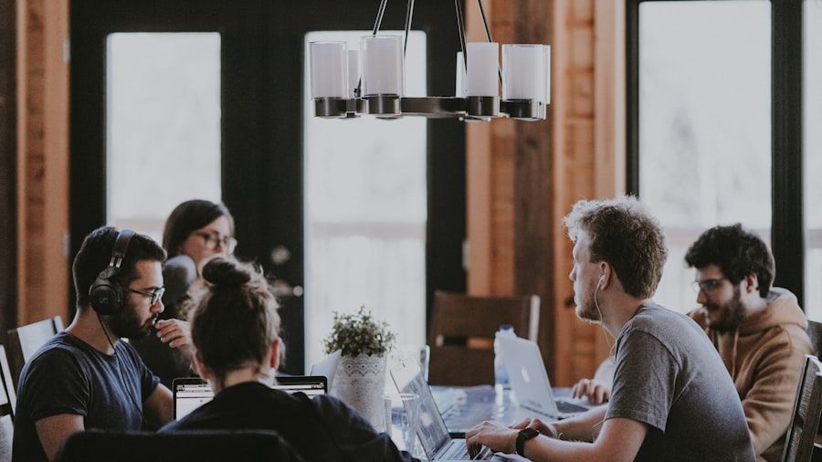 A team gathered around a table in a working meeting.