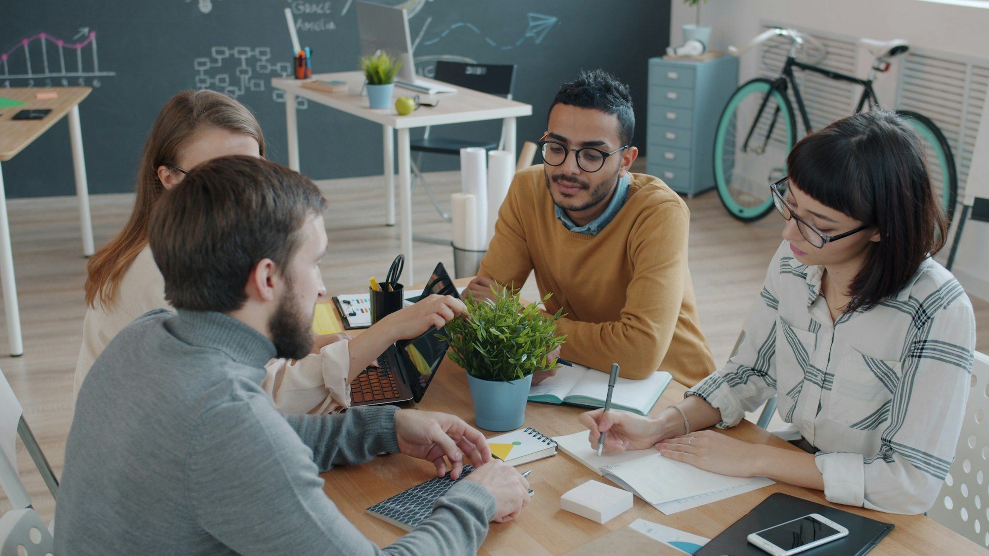 Team collaborating around a table in an office