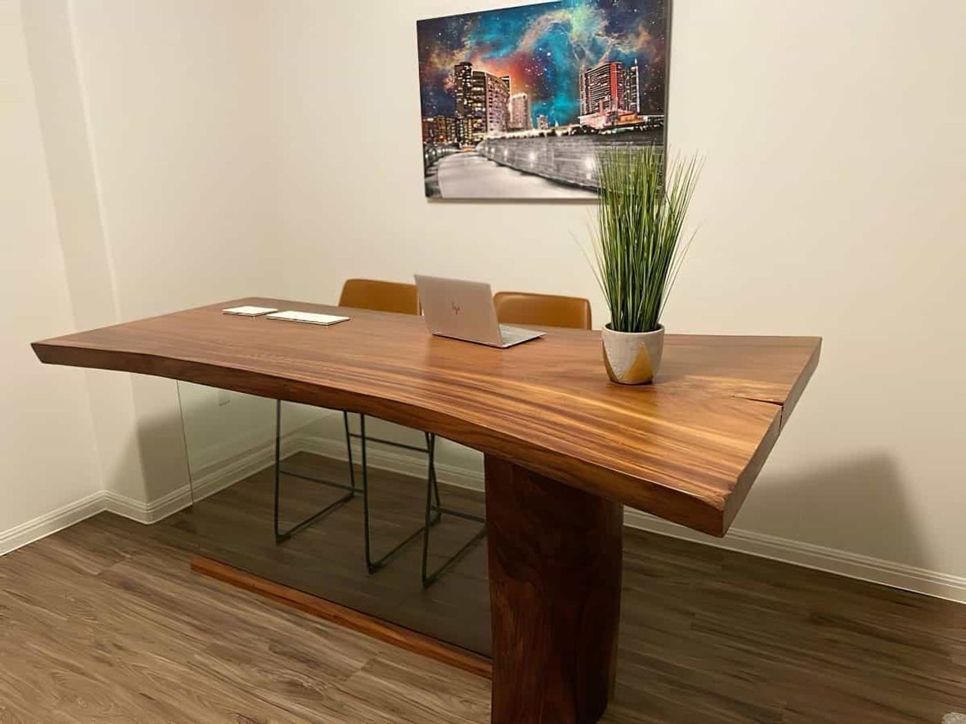An image of a table with a raw edge, showcasing the untouched and natural edge of the wood or other materials, adding an element of raw beauty and authenticity.