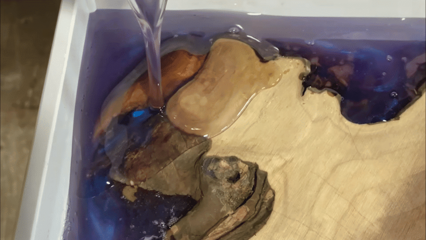 light-blue-epoxy-pouring-on-a-live-edge-slab