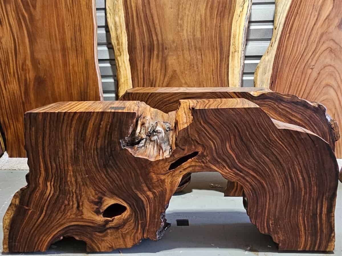 Image of custom live edge tables and raw wood slabs, highlighting the natural grain and quality of solid wood, perfect for DIY projects and personalized home décor.