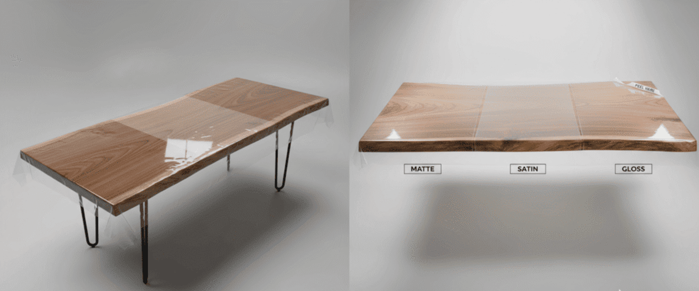 Live-edge walnut dining table with glossy epoxy resin top and black hairpin legs, photographed on a neutral gray background.