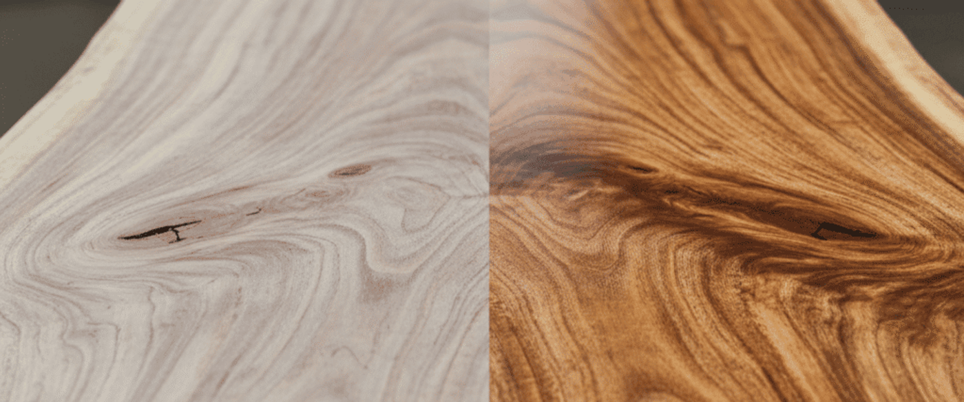 Raw and finished live-edge walnut table top split down the middle showing pale sanded wood on left and rich polished grain on right.