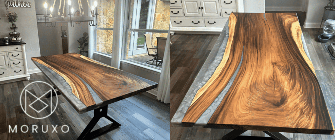 Live-edge epoxy cofee table with gray resin river inlay, black metal X-base, placed in bright kitchen with white sideboard and pendant light crafted by moruxo.