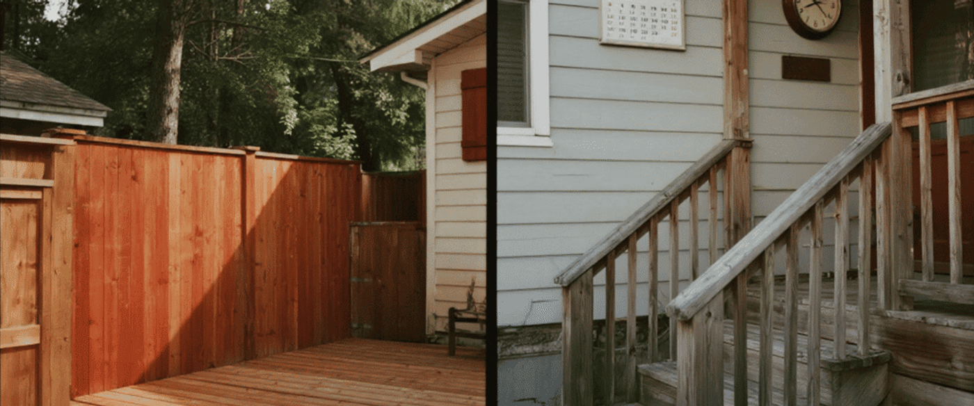 Sunlit backyard deck with red wooden fence on left and weathered house steps, clock, and calendar on the right.