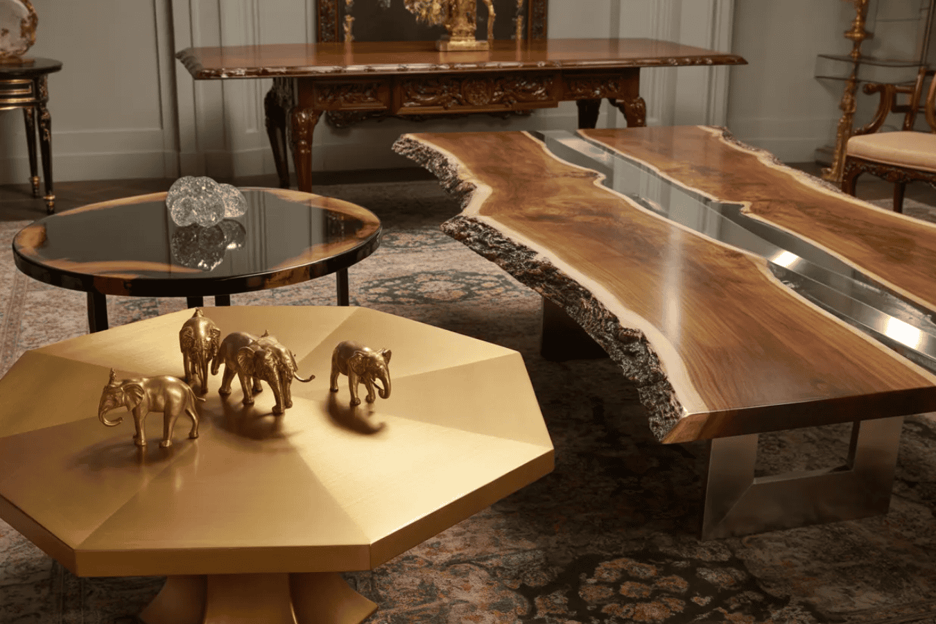 Elegant living room with unique coffee tables: a live-edge wood and metal table, a round wood and glass table, and a gold geometric table with decorative elephant figurines.