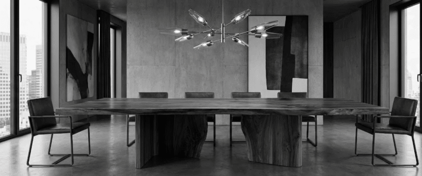 Modern boardroom with a long live-edge wooden table, leather chairs, abstract wall art, floor-to-ceiling windows and a sculptural chandelier