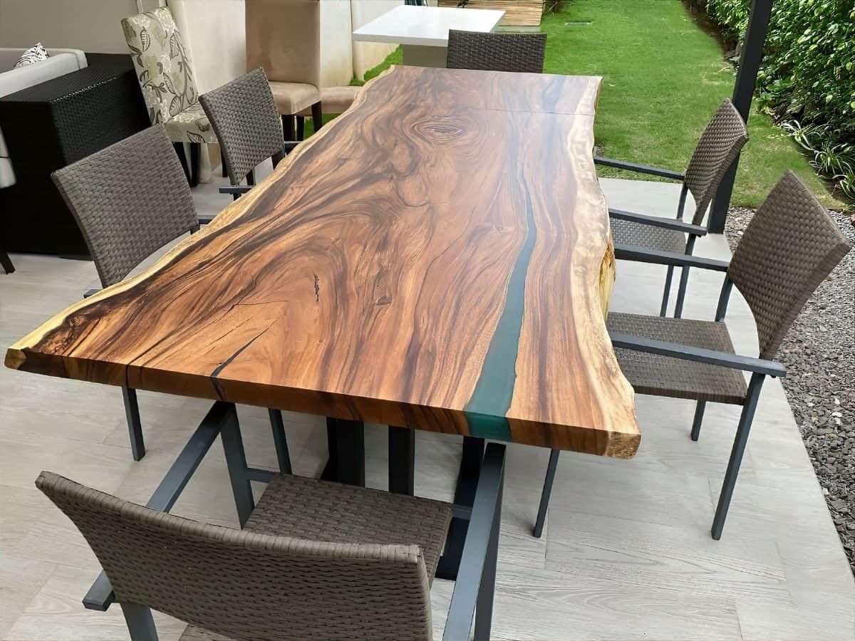 Rectangular live edge table with stunning blue epoxy accents.