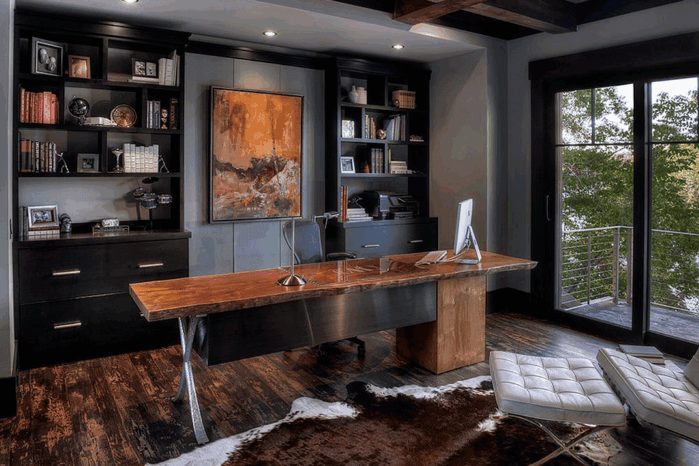 Stylish home office with a live-edge desk, slate gray walls, and blue accents showing harmony between cool tones and natural wood.