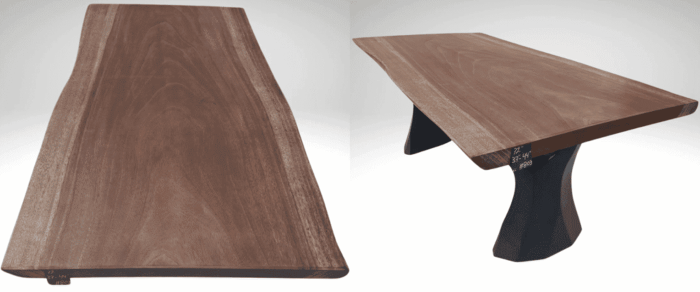 ive-edge walnut slab dining table with sculpted black pedestal legs, natural grain top and tapered handcrafted silhouette