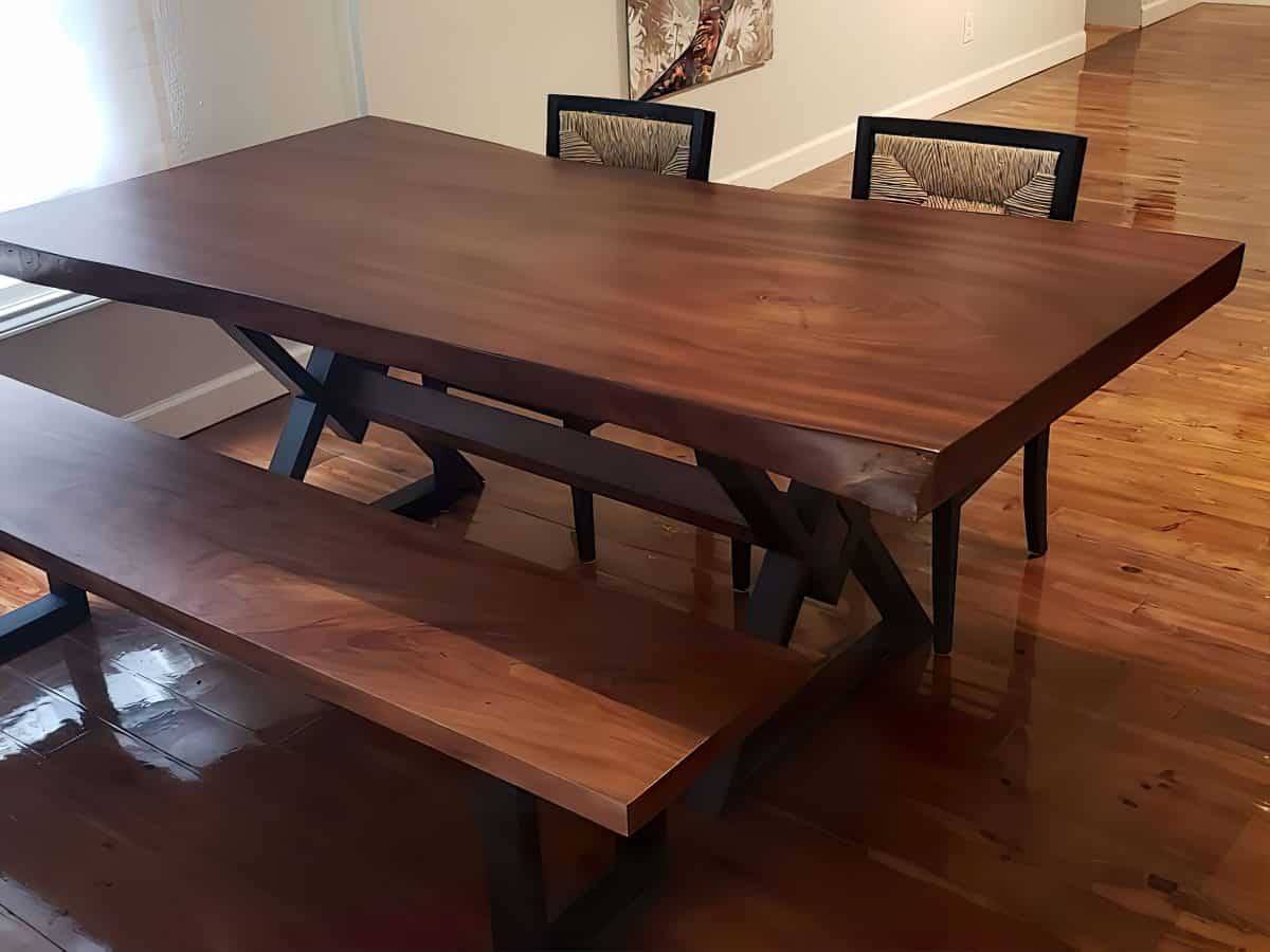 Live edge table and live edge bench made from live edge lumber in a modern dining room.