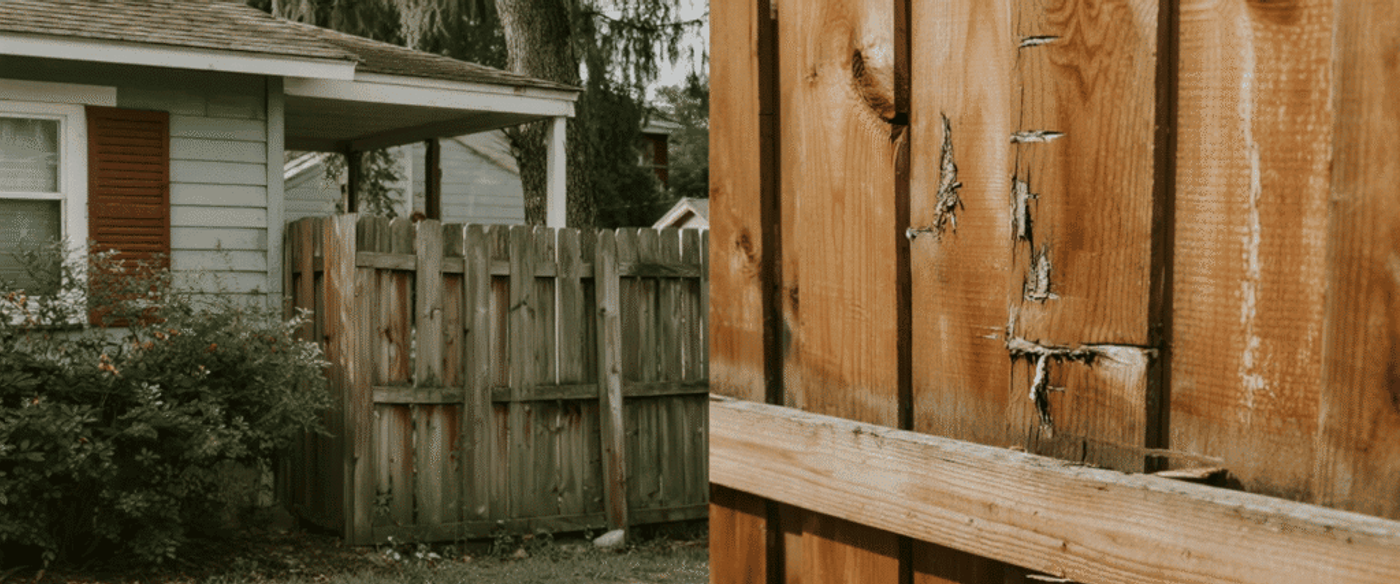 Weathered wooden backyard fence with leaning panels and close-up view of splintered, cracked boards under sunlight.