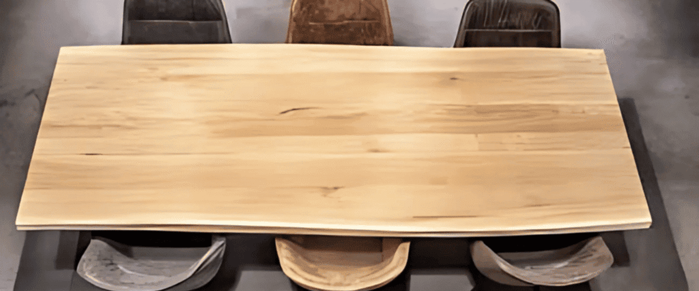 Top Oak Wood of a wooden dining table with five mixed leather and fabric chairs arranged around it.